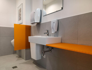 Moxie Surfaces - urinal partition clear PEP satin orange