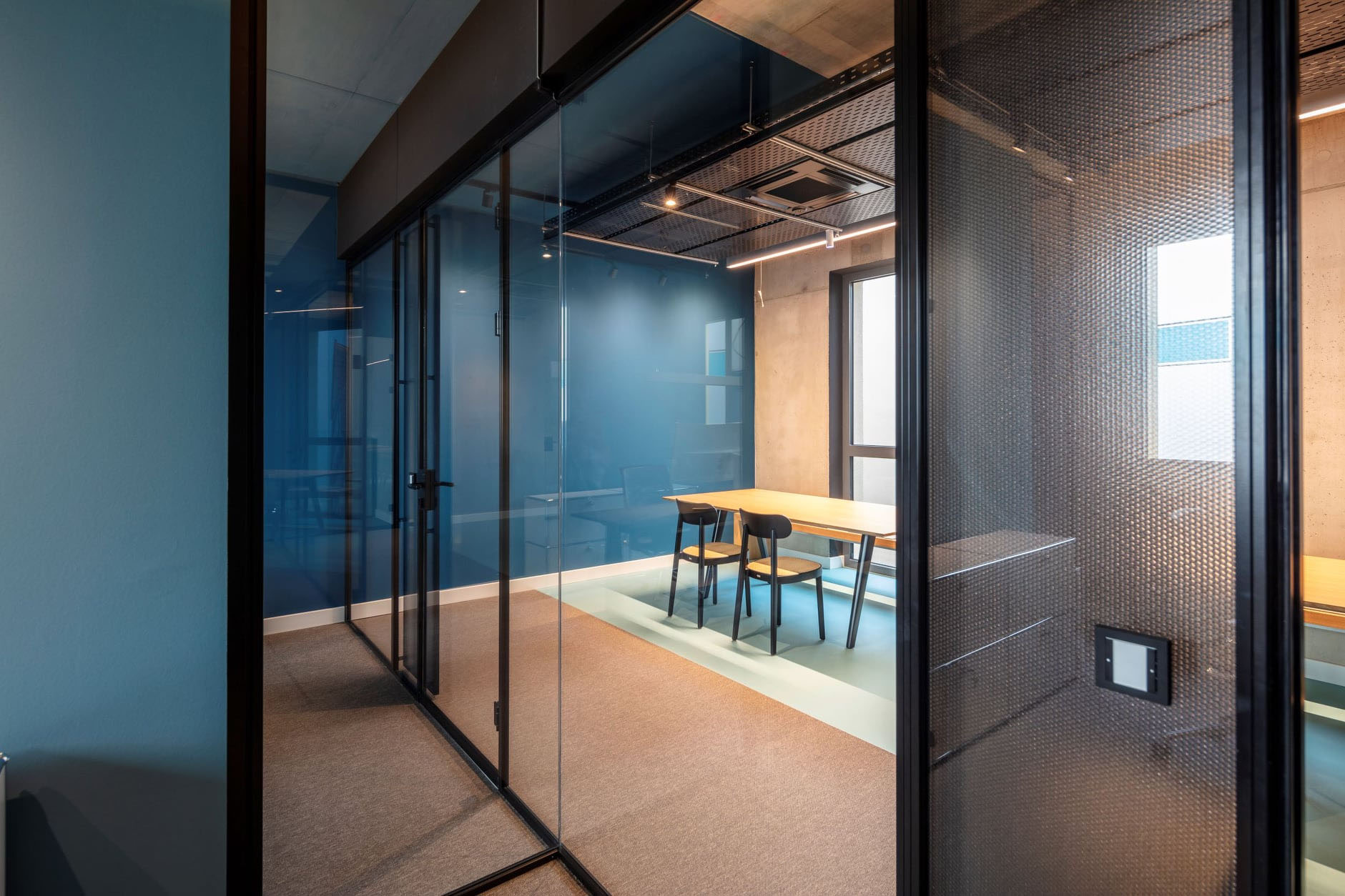 MoxieSurfaces - Black AIR-board panels - office installation detail