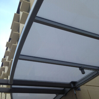 Translucent clear-PEP canopy and covered walkway for tall residential and office buildings Translucent clear-PEP canopy and covered walkway for tall residential and office buildings